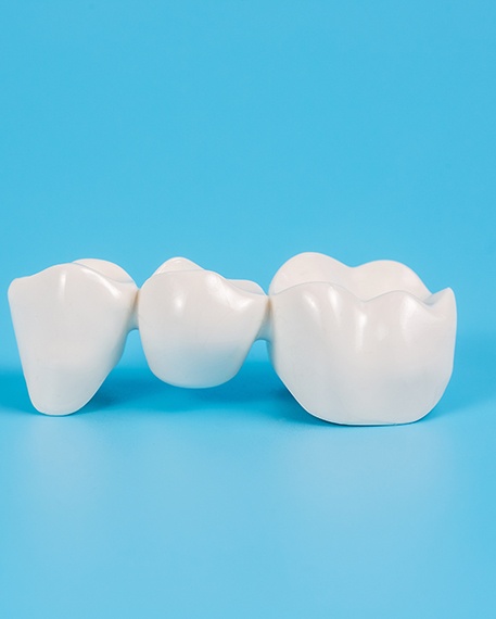 Dental bridge on a light blue background