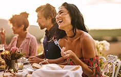 a woman at an outdoor dinner party