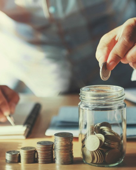 Money being put into a jar