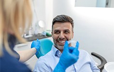 Man at the dentist getting Invisalign